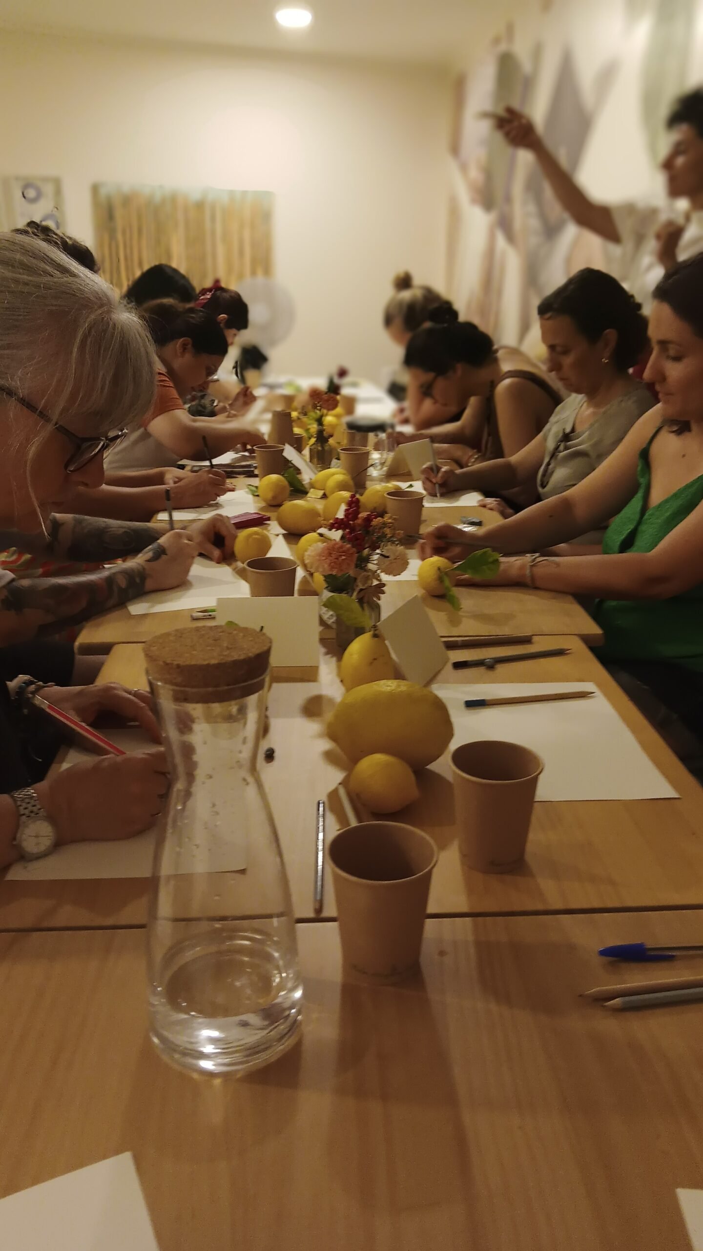 Participants working together around a table at an EduMansha workshop
